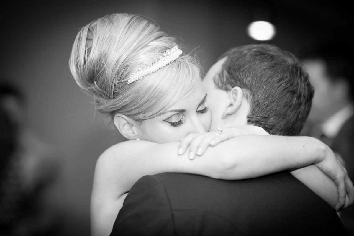 bride hugging groom 